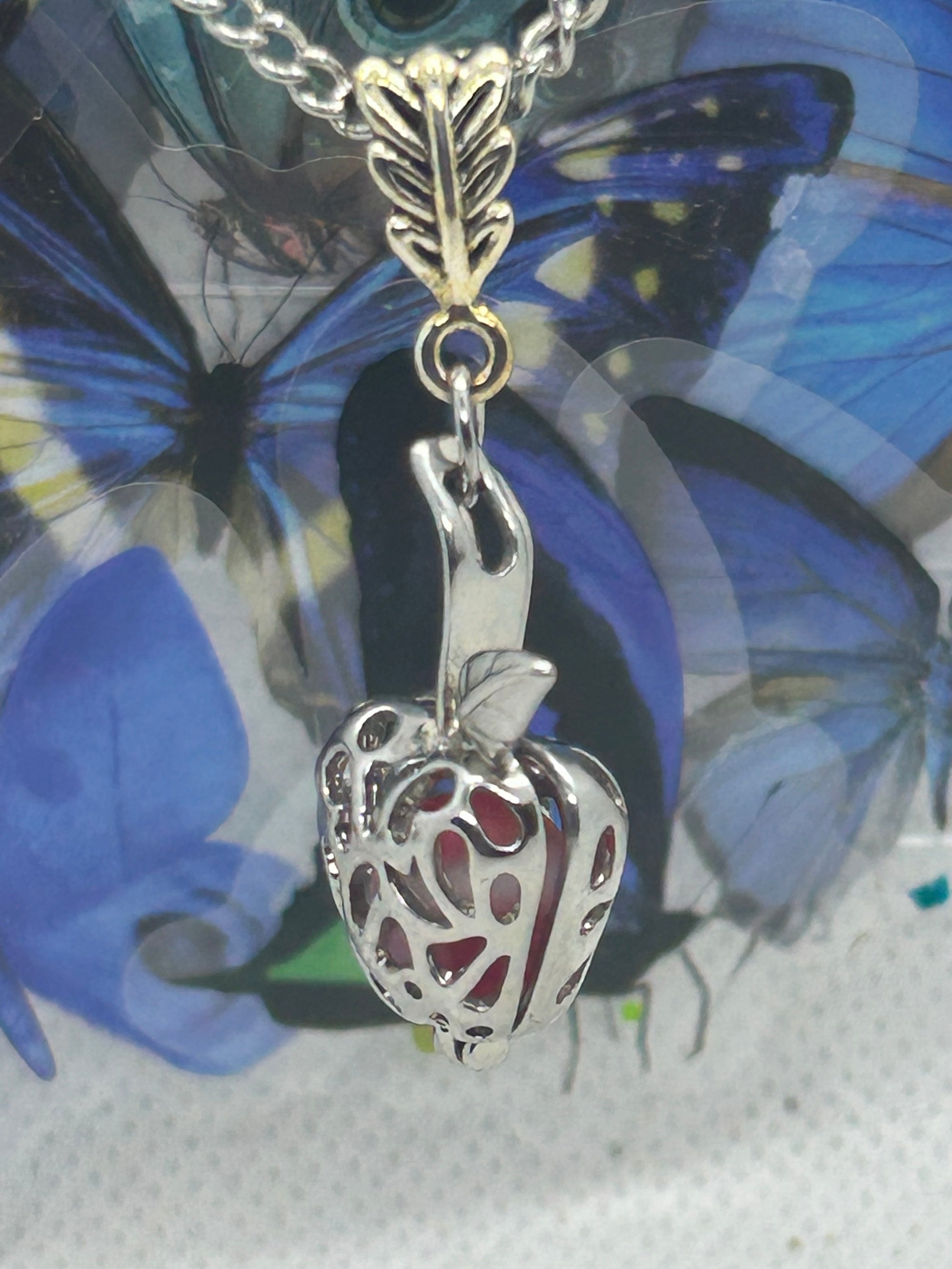 Red Glowing Mermaid bead incased in a Silver Apple Necklace