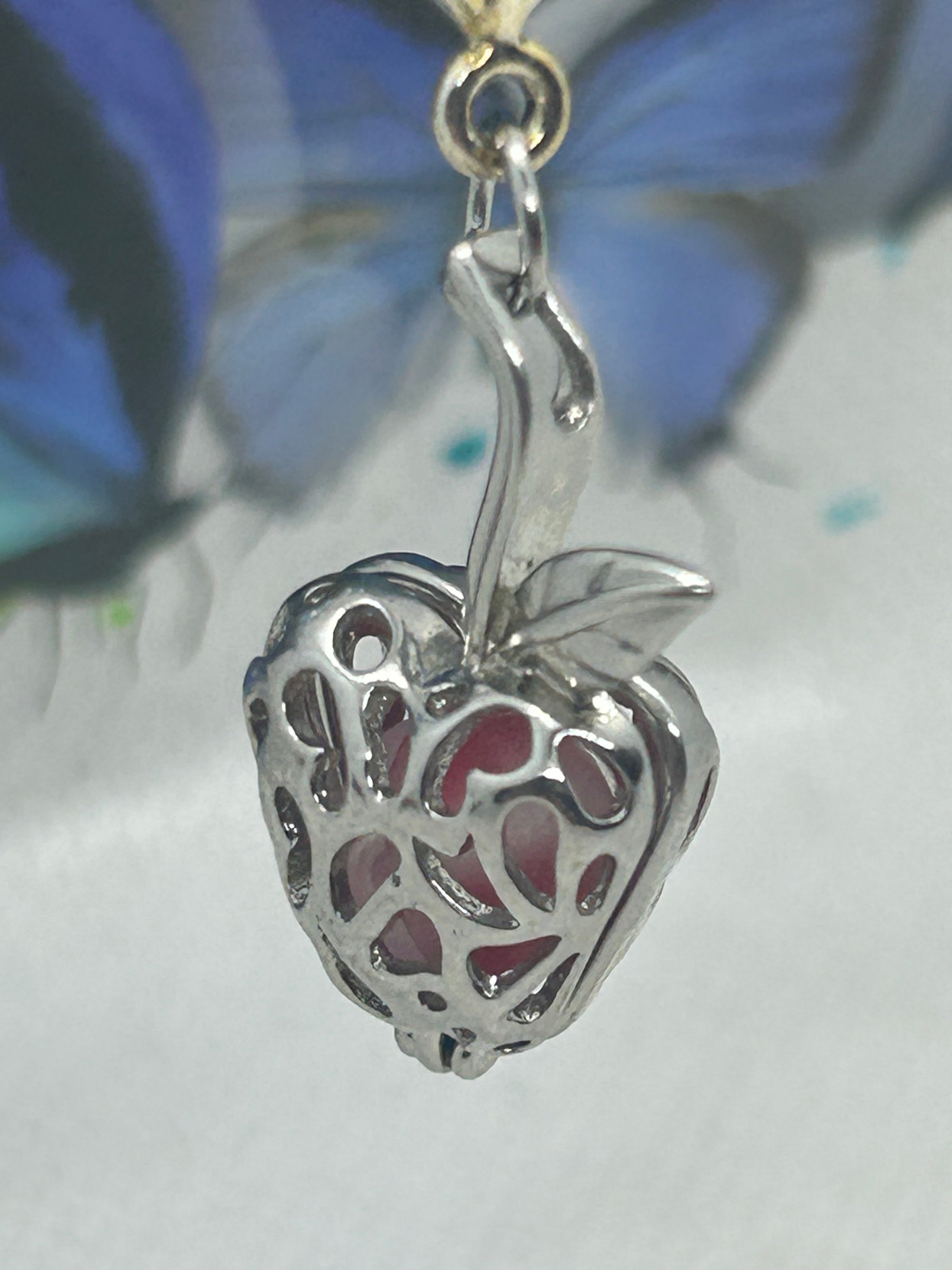 Red Glowing Mermaid bead incased in a Silver Apple Necklace