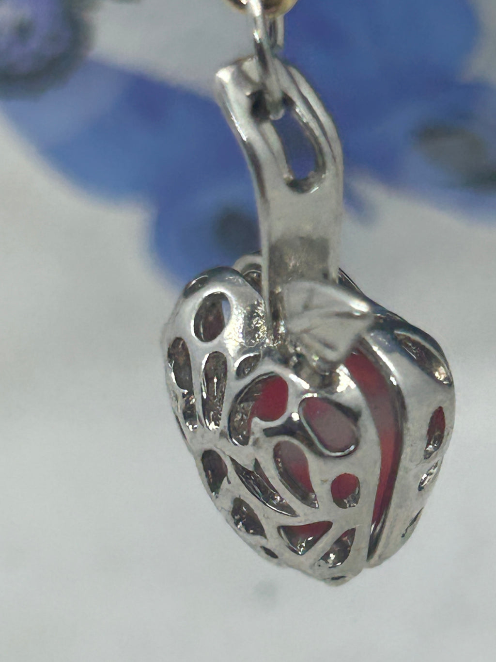 Red Glowing Mermaid bead incased in a Silver Apple Necklace