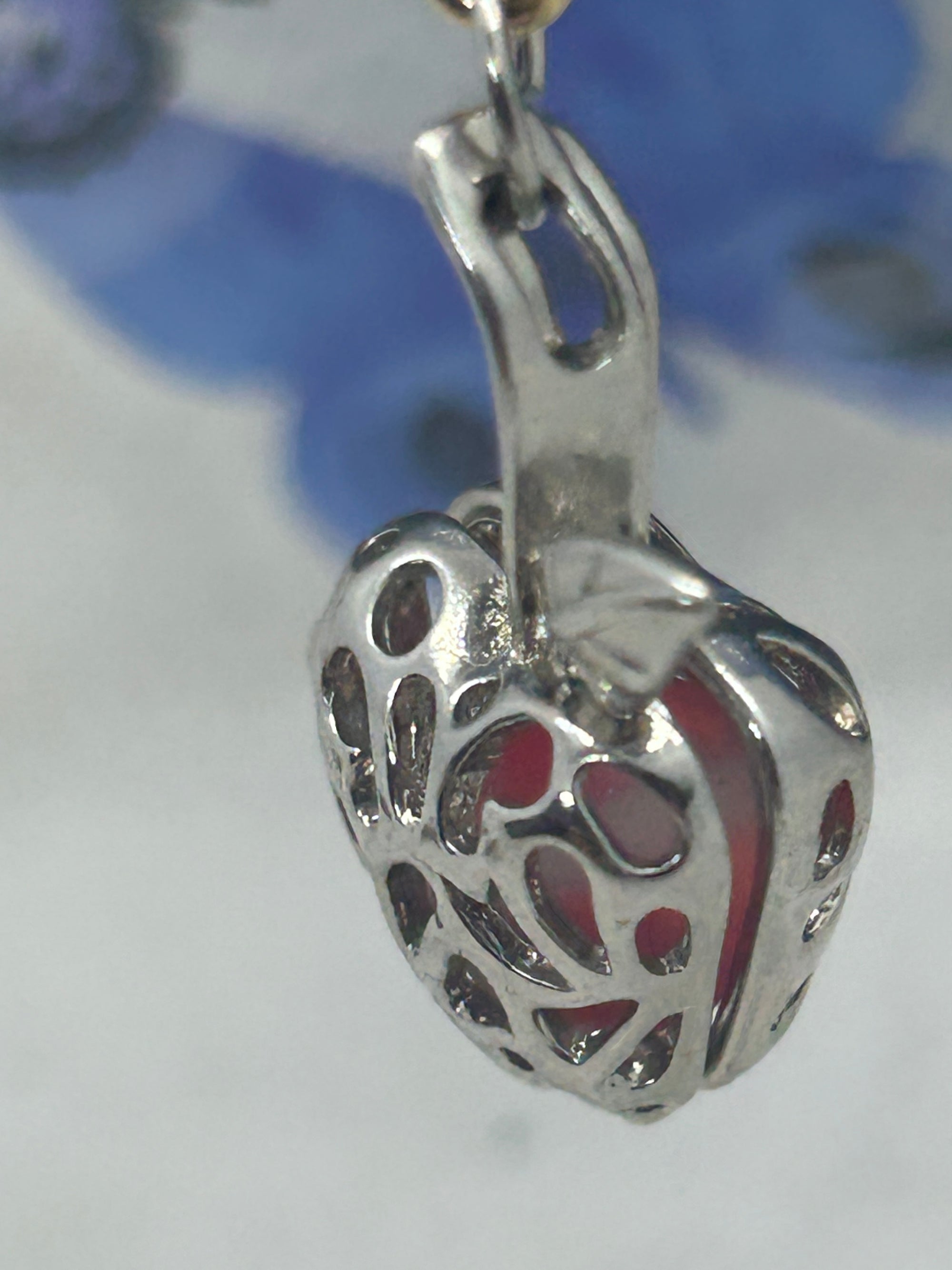 Red Glowing Mermaid bead incased in a Silver Apple Necklace