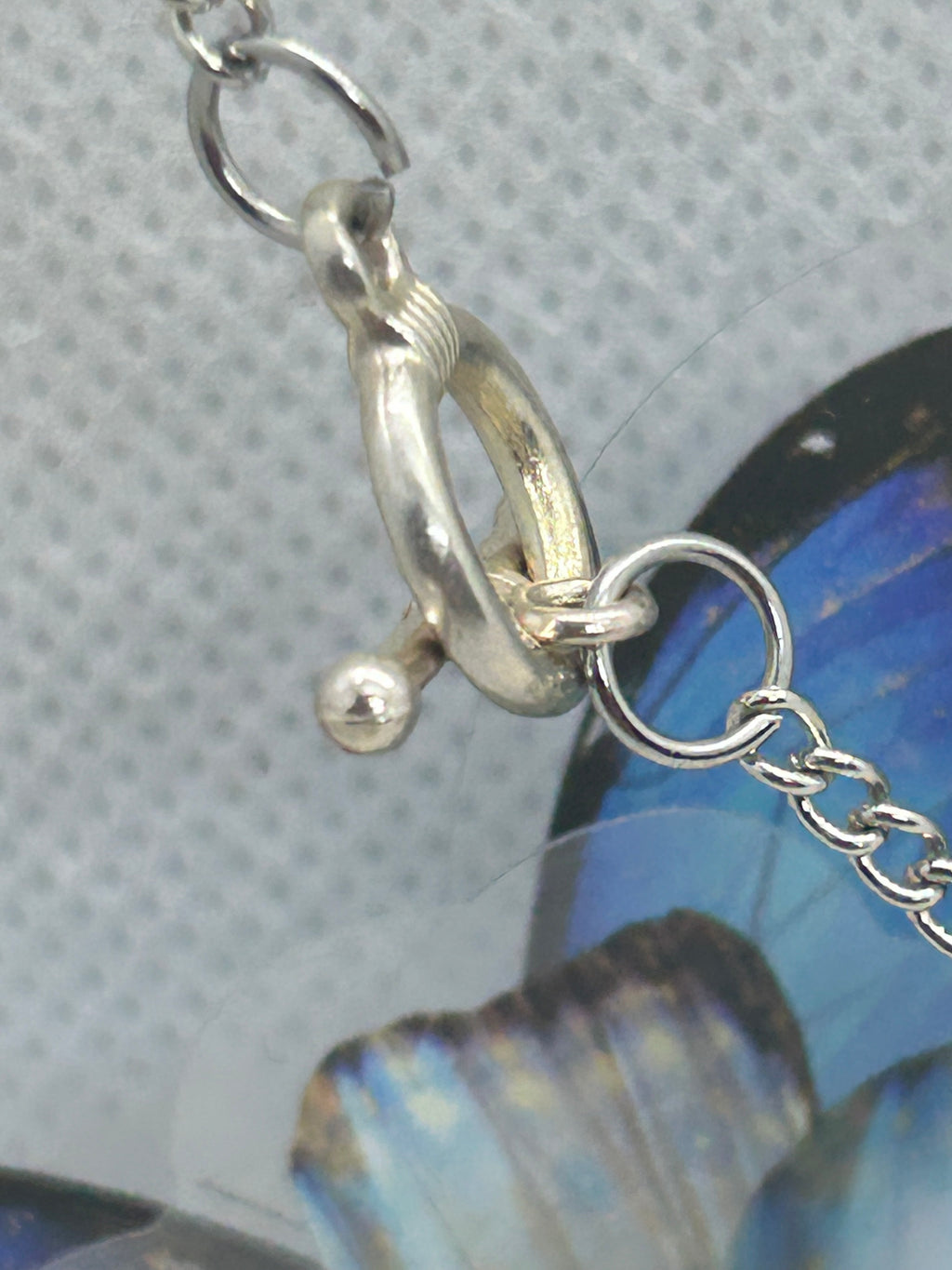 Red Glowing Mermaid bead incased in a Silver Apple Necklace