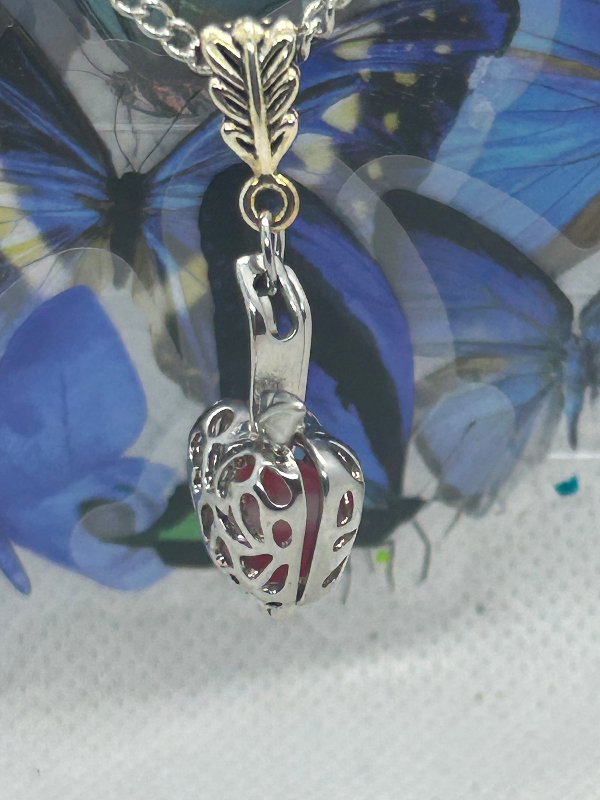Red Glowing Mermaid bead incased in a Silver Apple Necklace