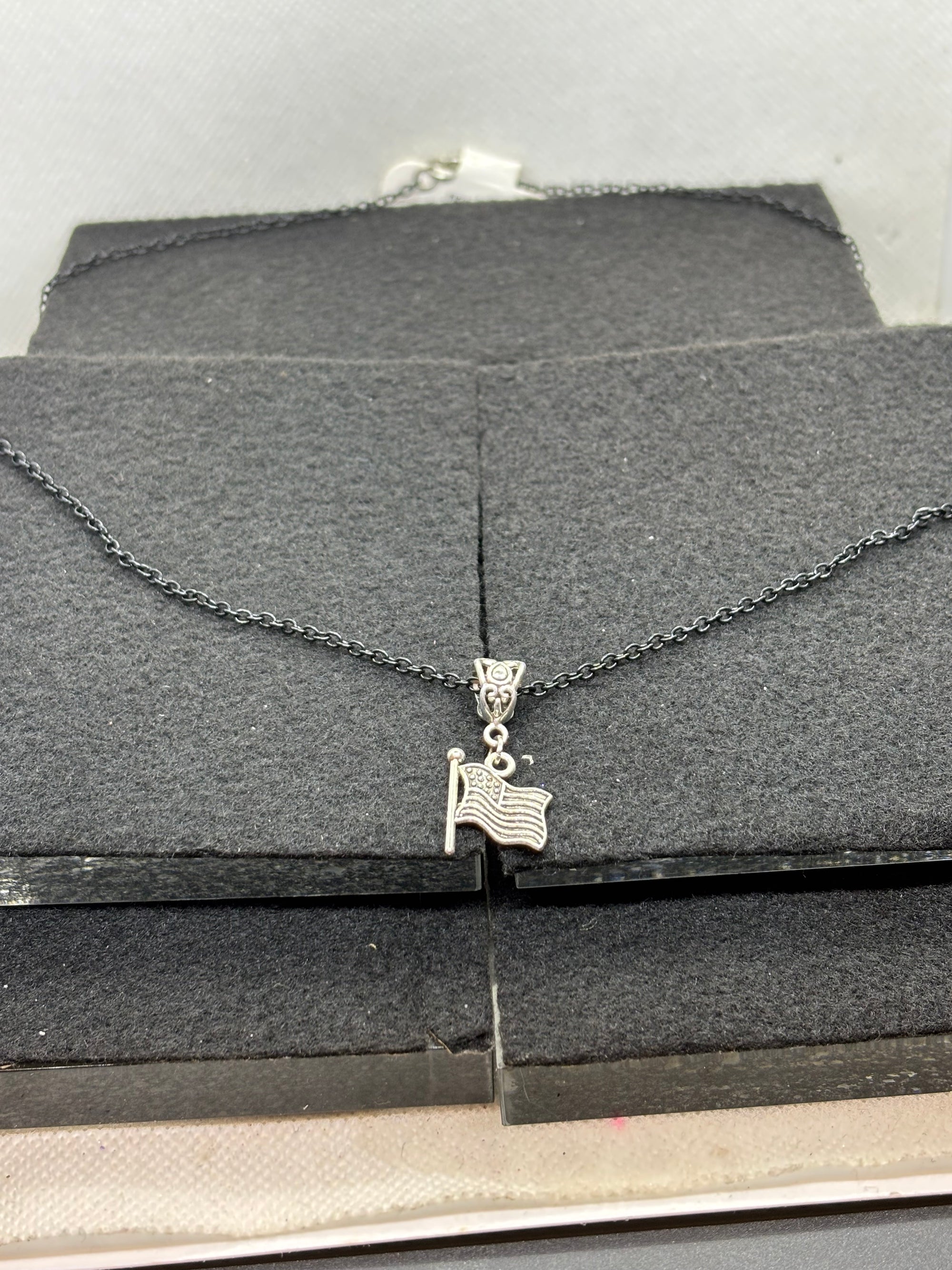 Black Necklace with an American flag Pendant