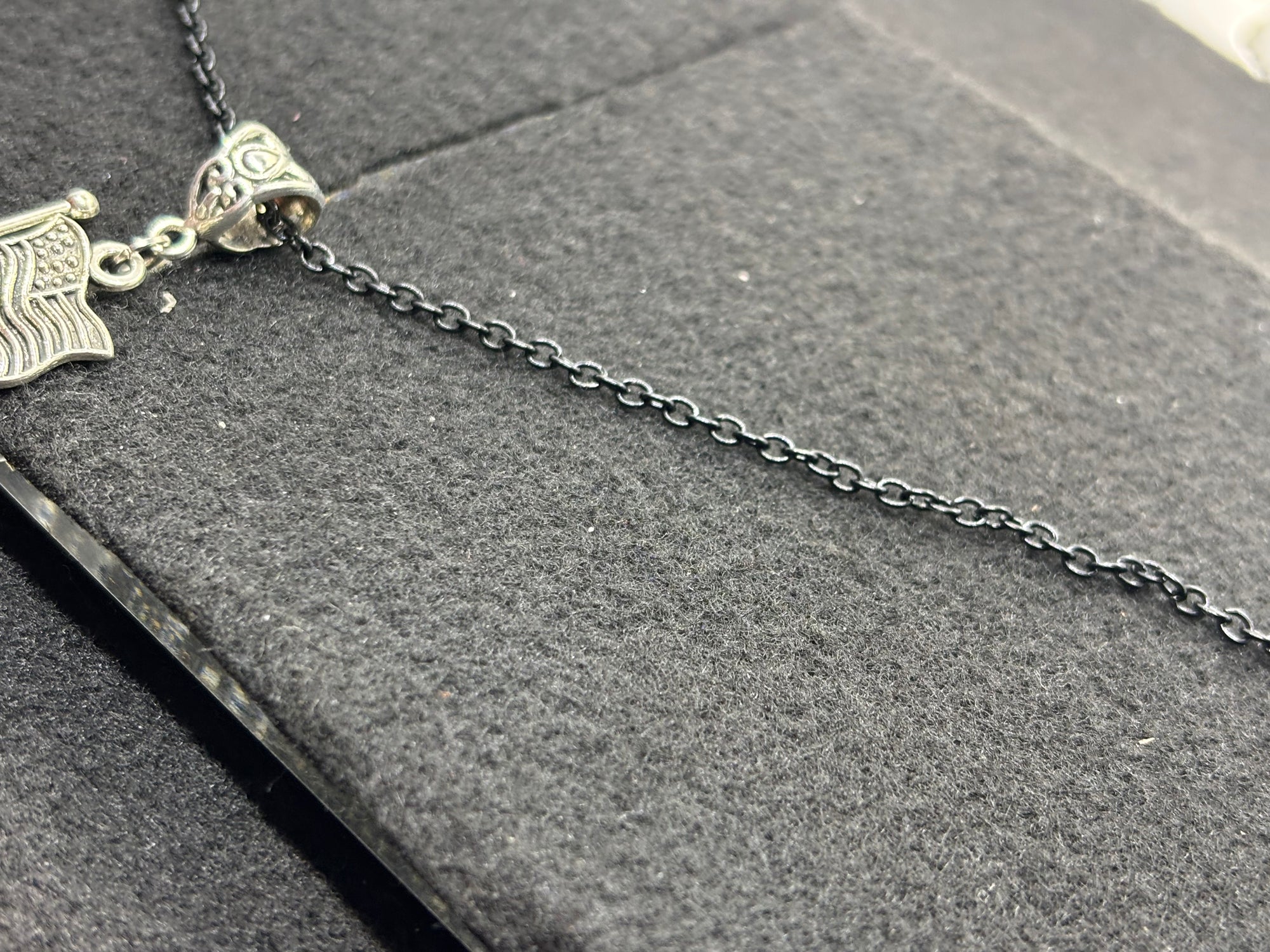 Black Necklace with an American flag Pendant