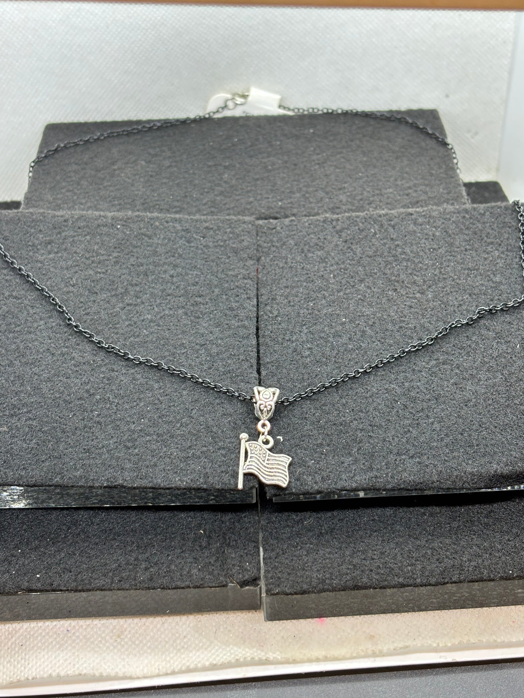 Black Necklace with an American flag Pendant