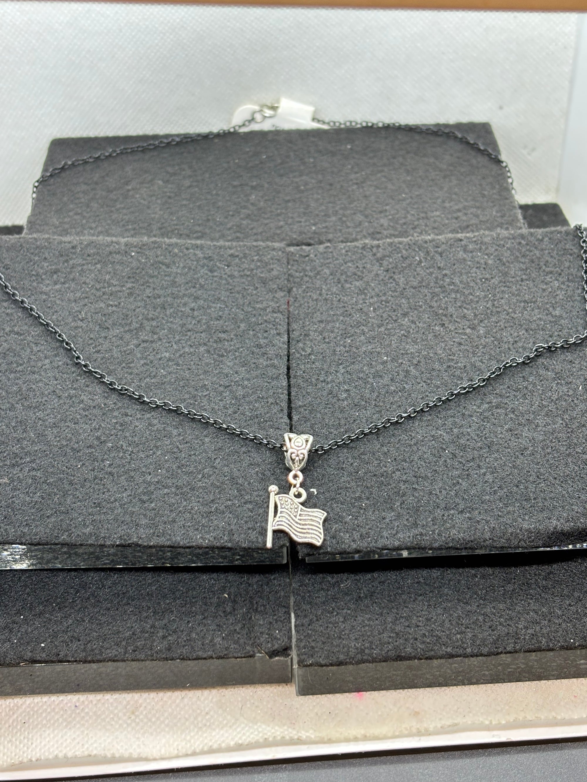 Black Necklace with an American flag Pendant