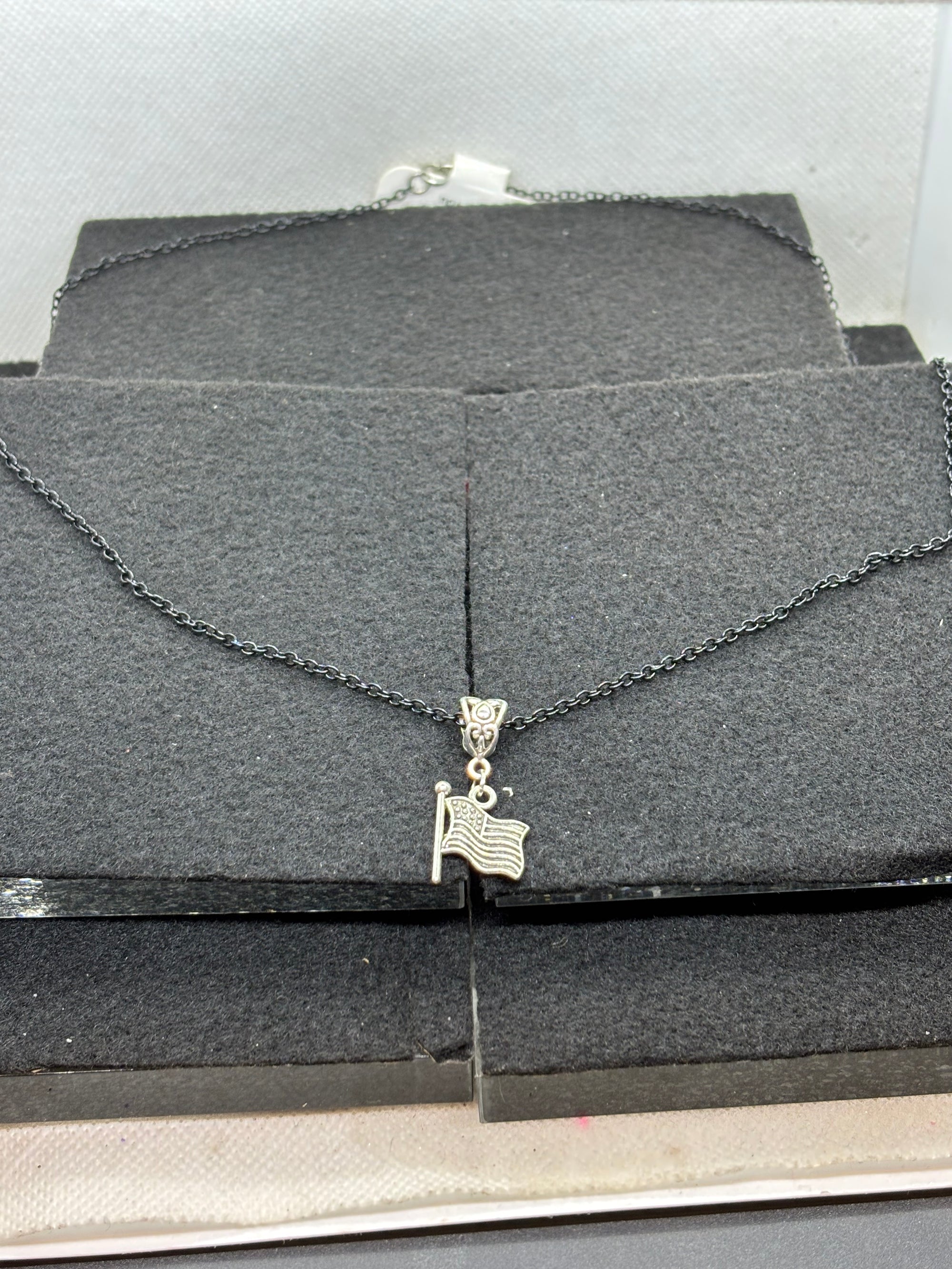 Black Necklace with an American flag Pendant