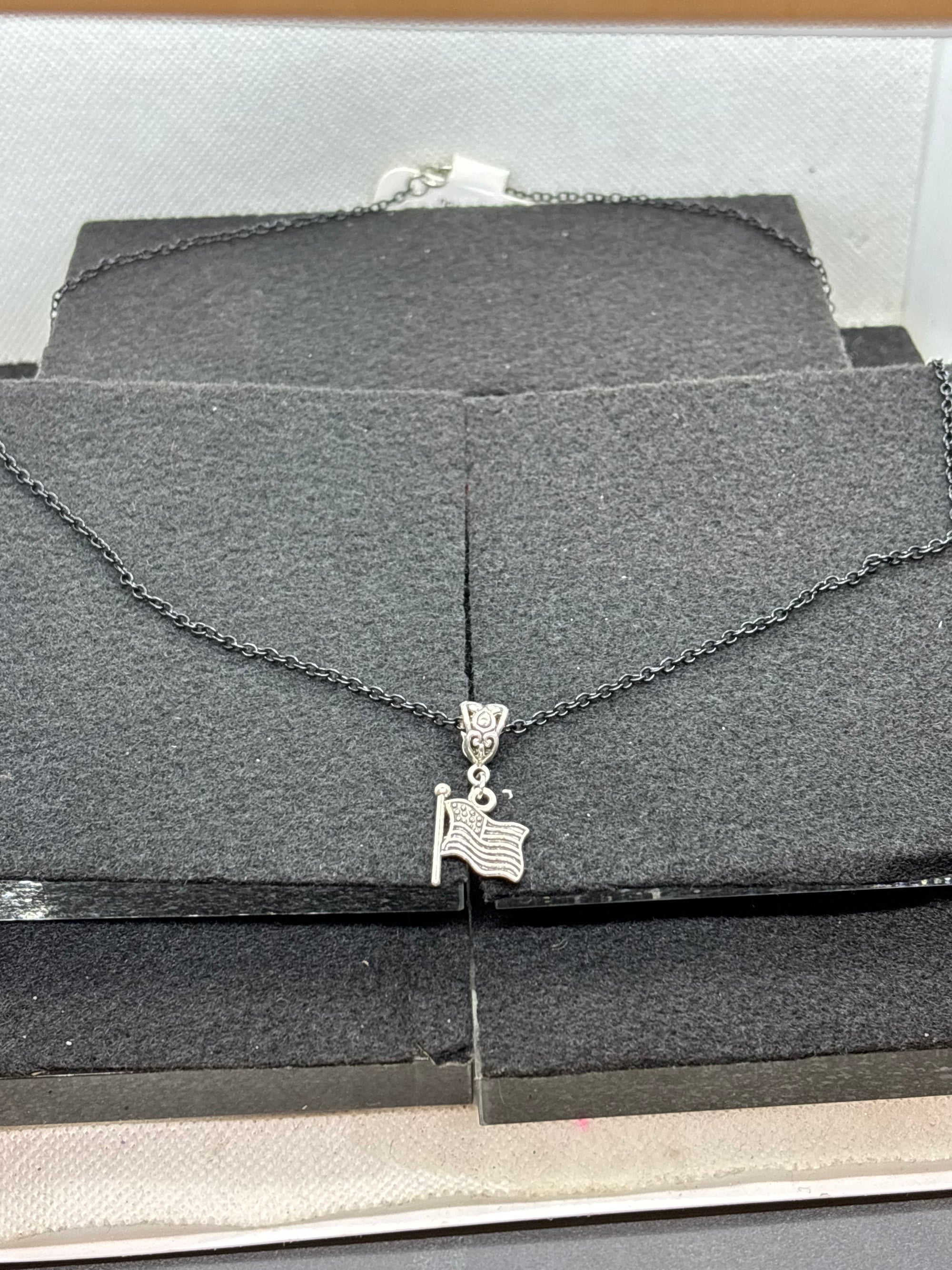 Black Necklace with an American flag Pendant