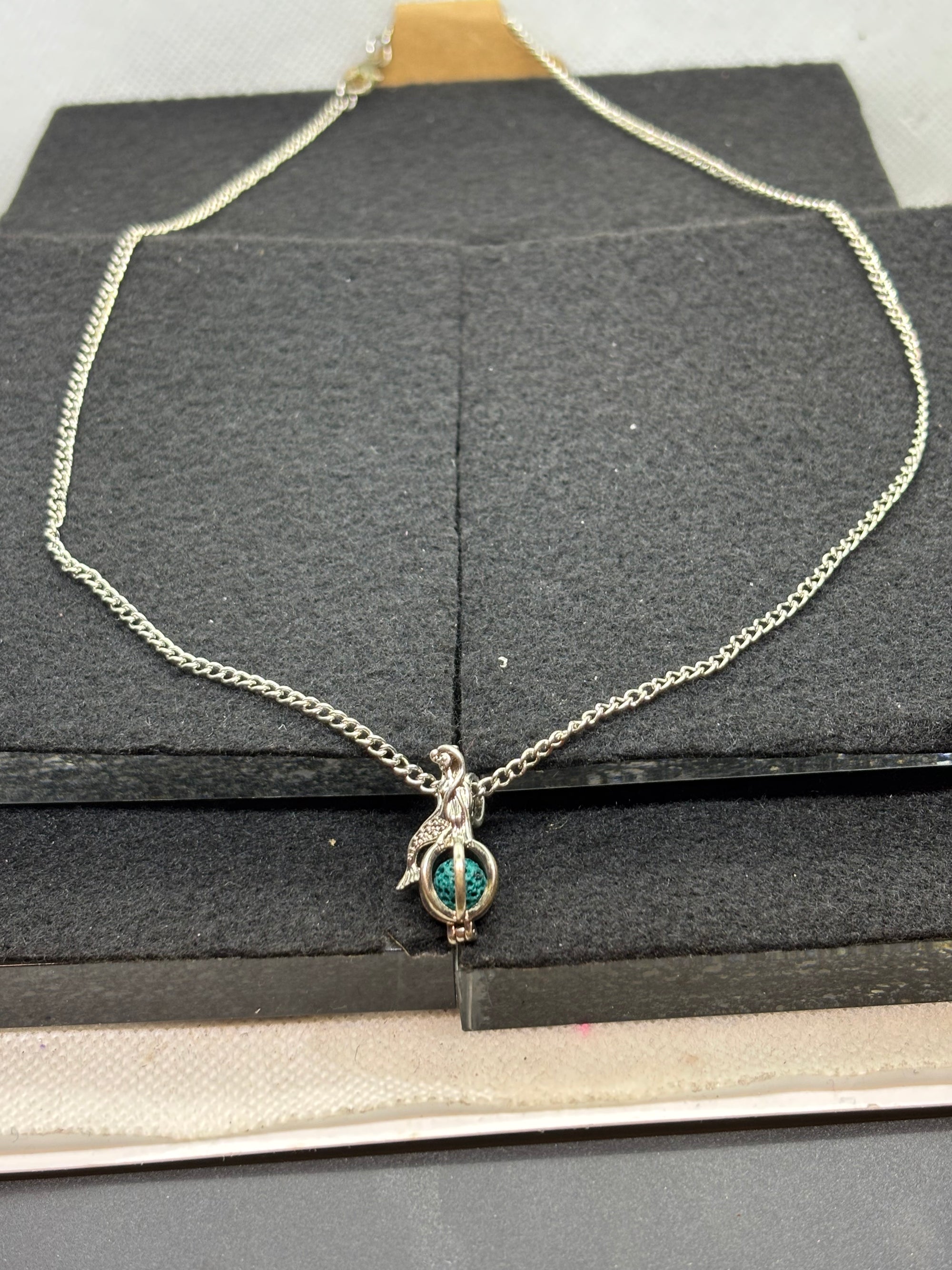 Mermaid with a Caged bead necklace