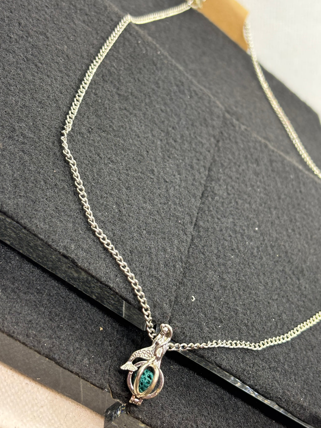 Mermaid with a Caged bead necklace