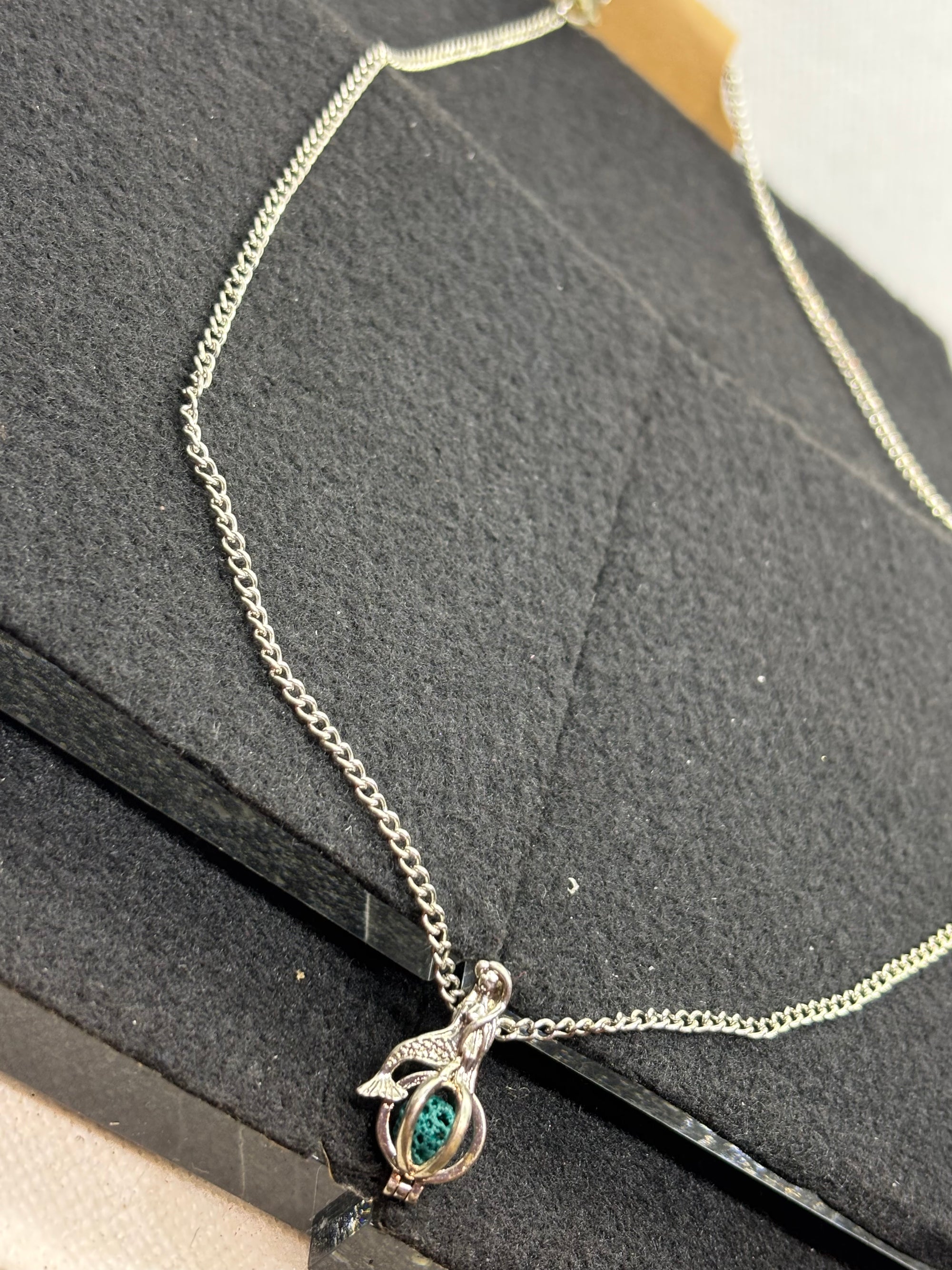 Mermaid with a Caged bead necklace