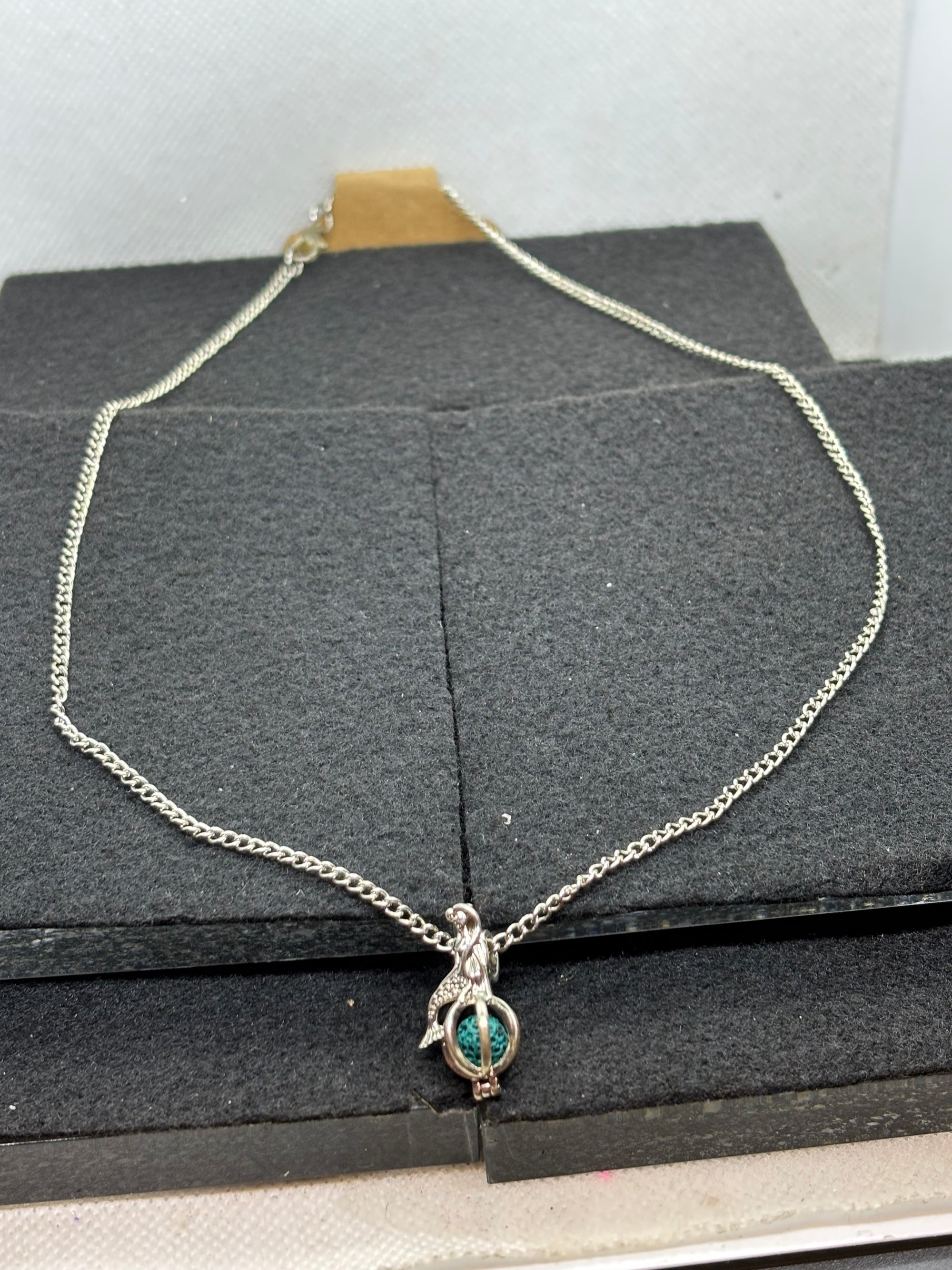 Mermaid with a Caged bead necklace