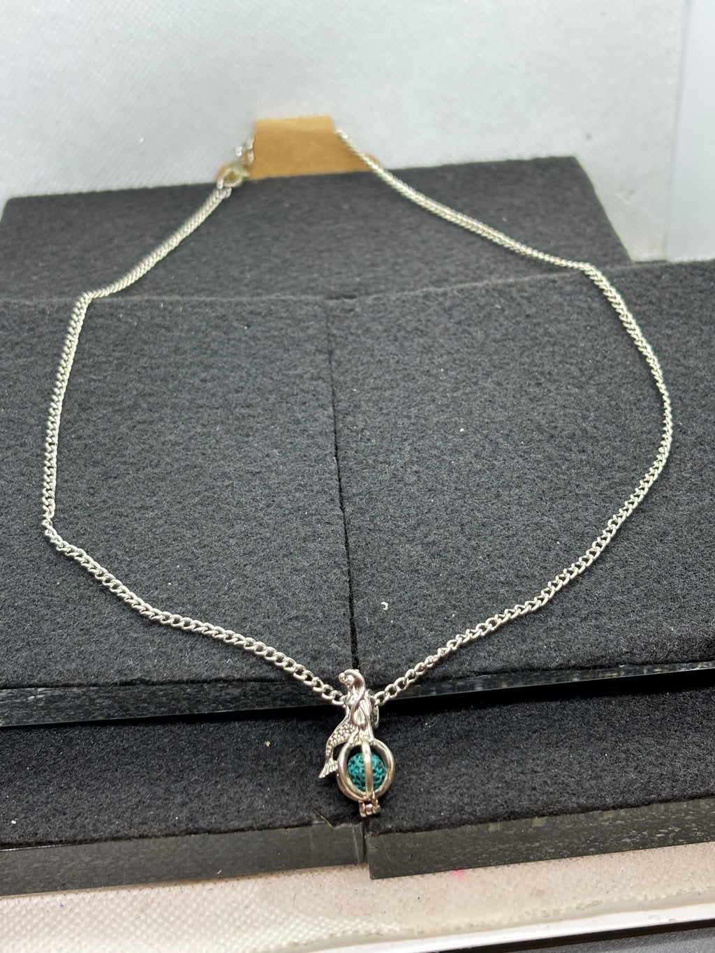 Mermaid with a Caged bead necklace