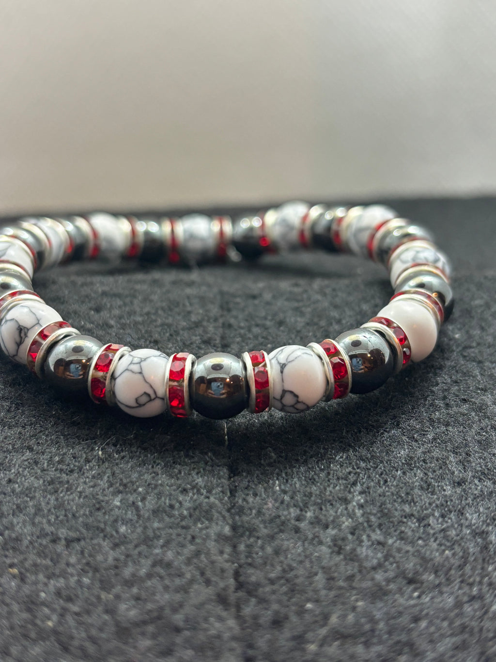 Howl lite and Hematite Beaded Bracelet with red rhinestone spacers