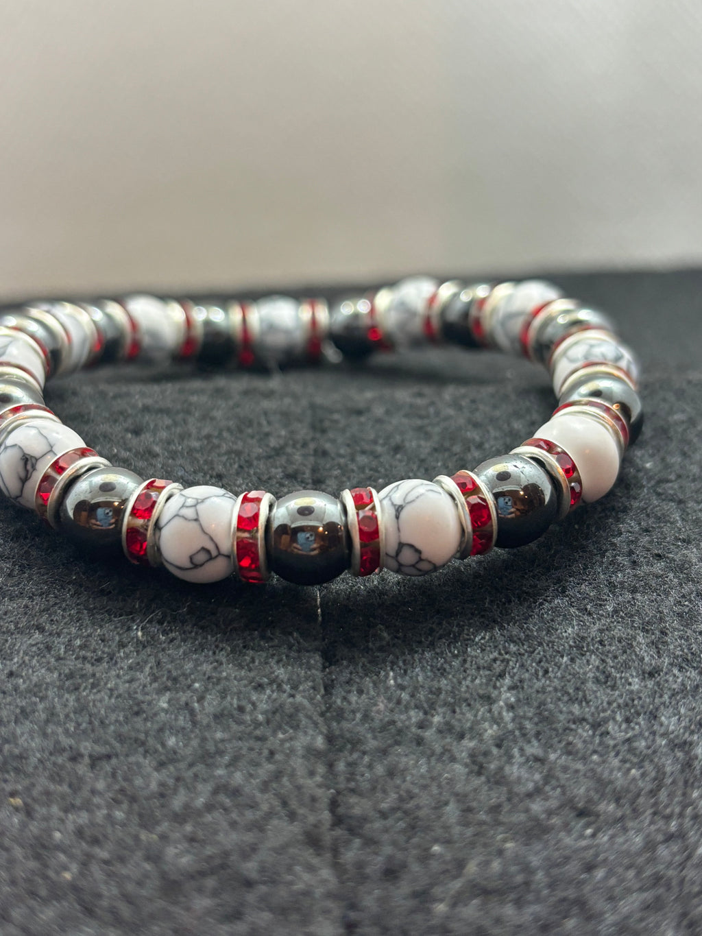 Howl lite and Hematite Beaded Bracelet with red rhinestone spacers