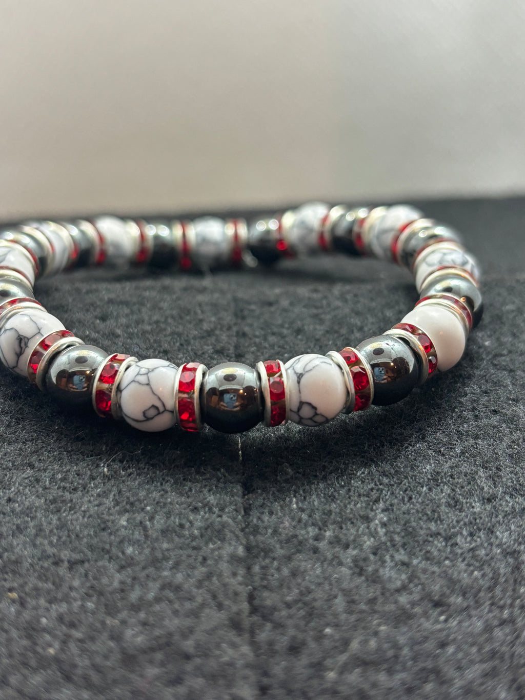 Howl lite and Hematite Beaded Bracelet with red rhinestone spacers