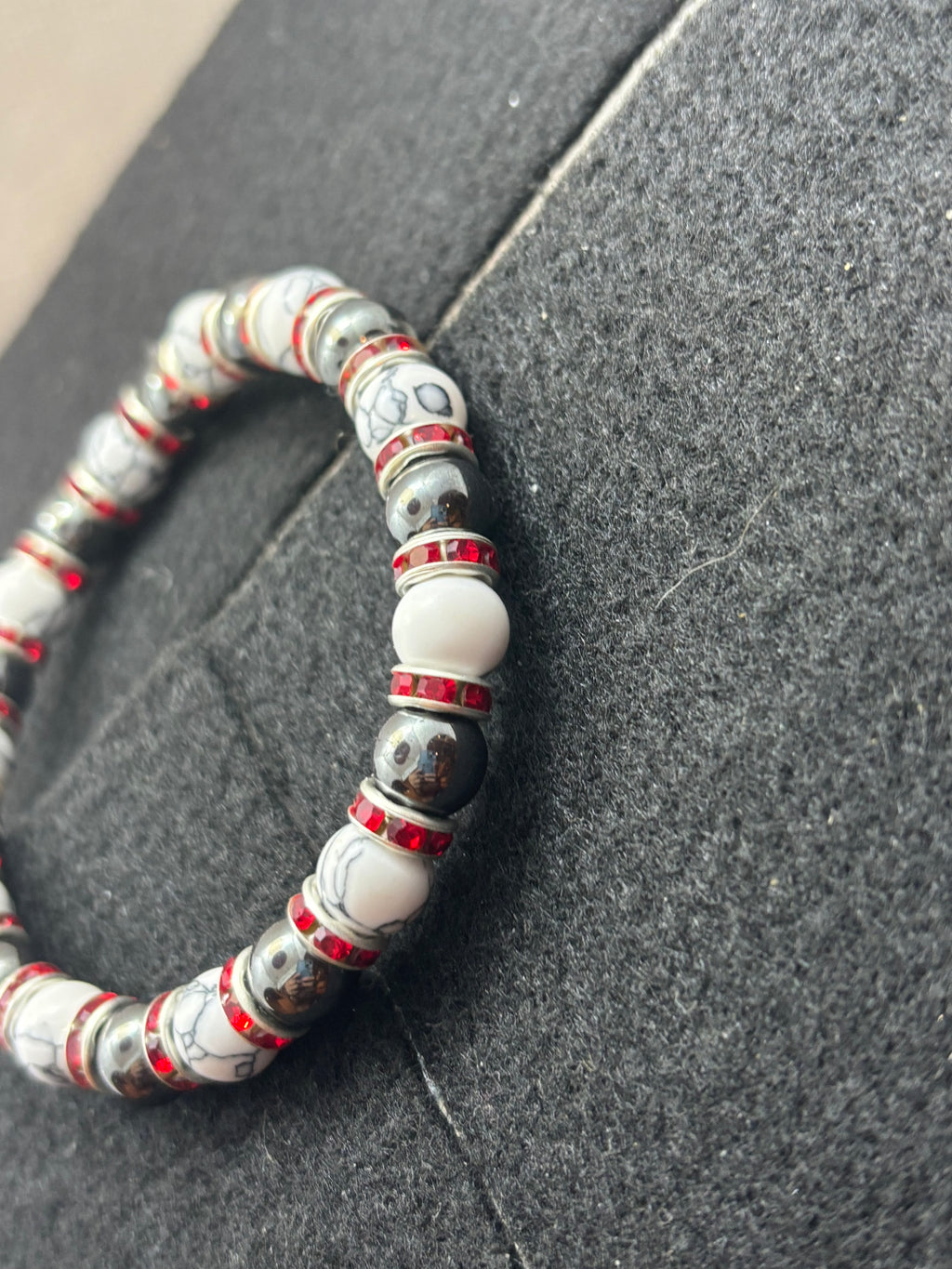 Howl lite and Hematite Beaded Bracelet with red rhinestone spacers