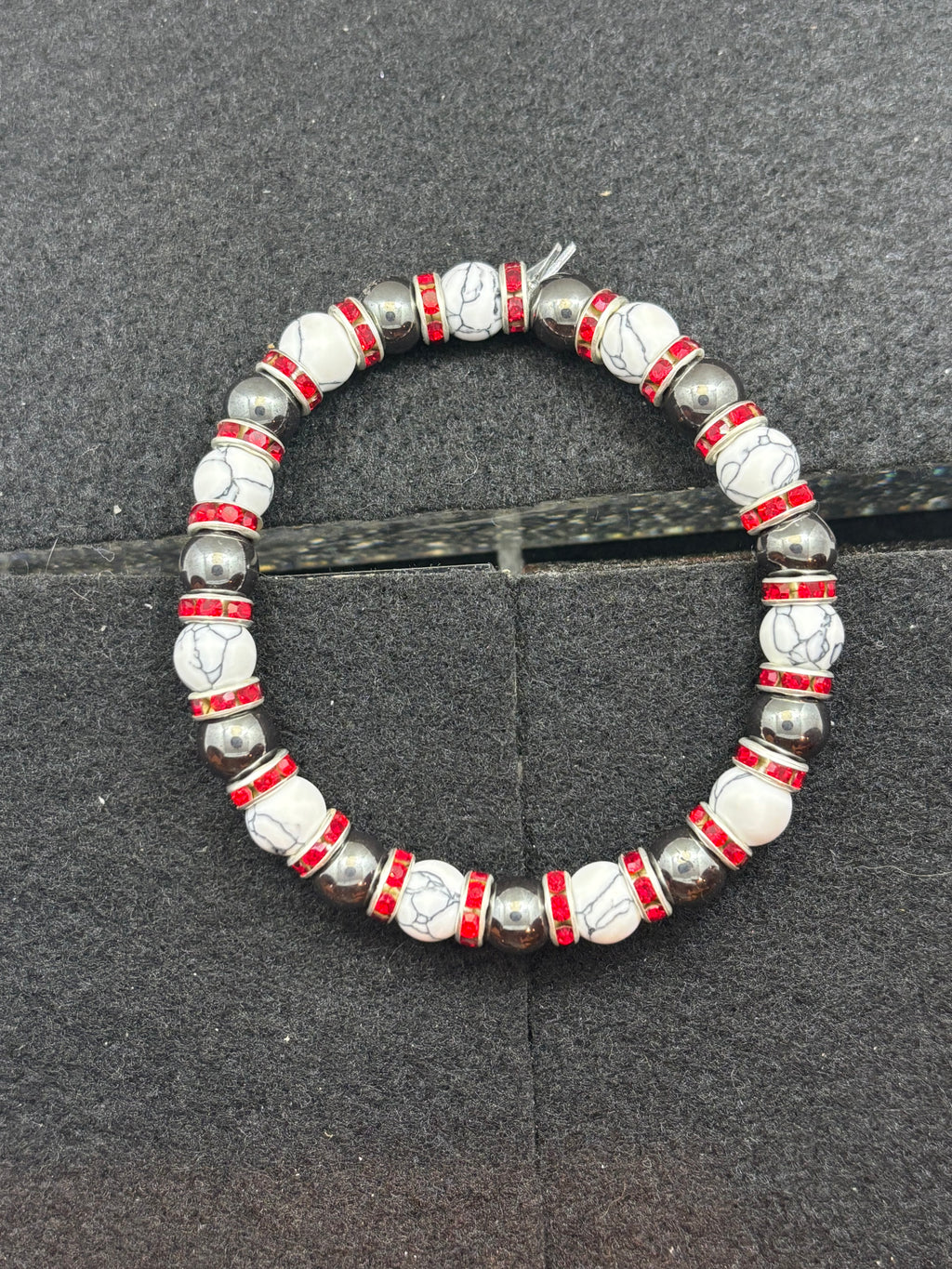 Howl lite and Hematite Beaded Bracelet with red rhinestone spacers
