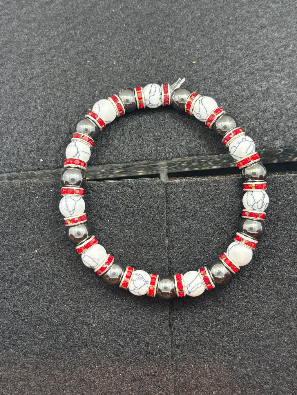 Howl lite and Hematite Beaded Bracelet with red rhinestone spacers