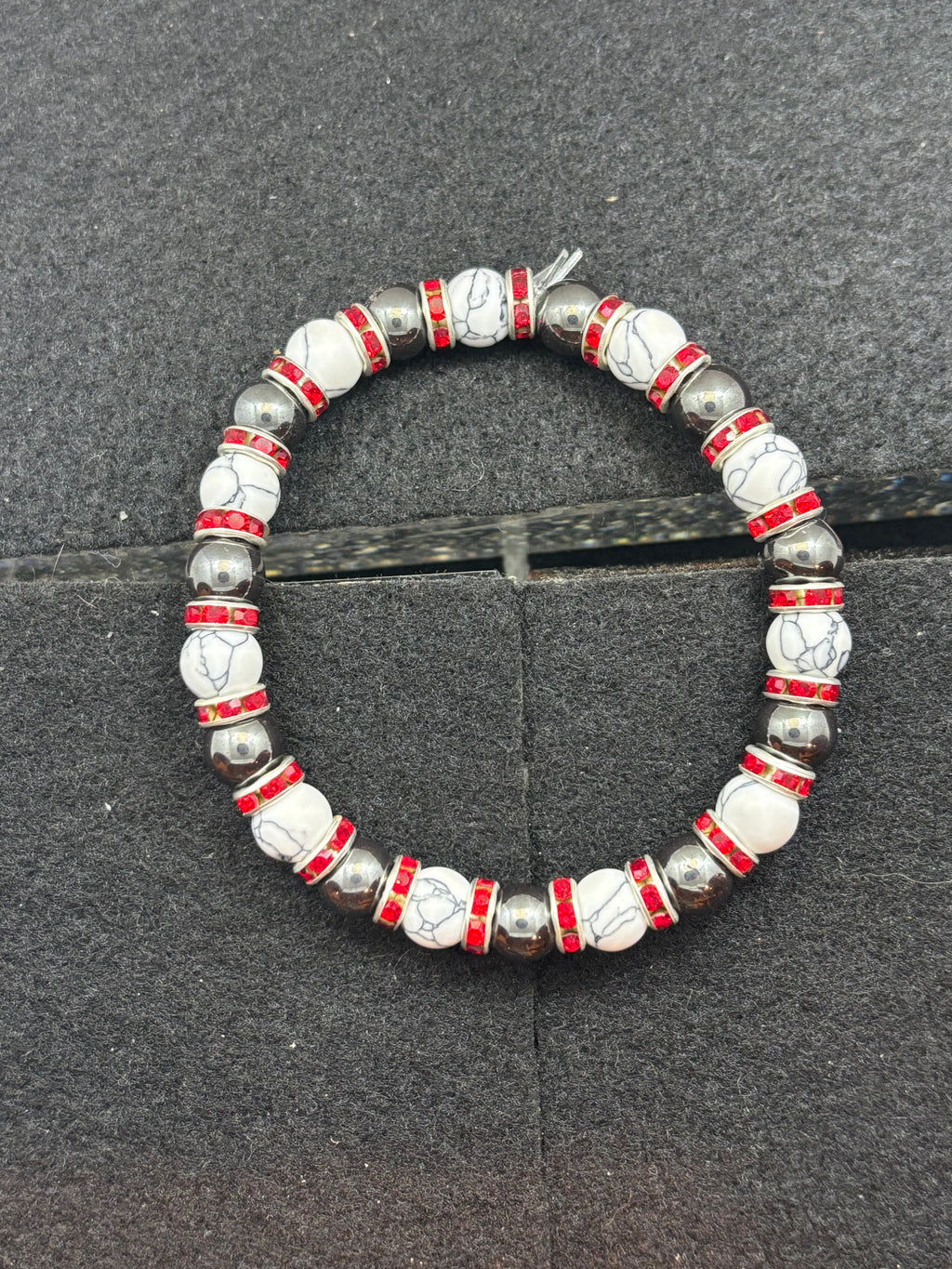 Howl lite and Hematite Beaded Bracelet with red rhinestone spacers