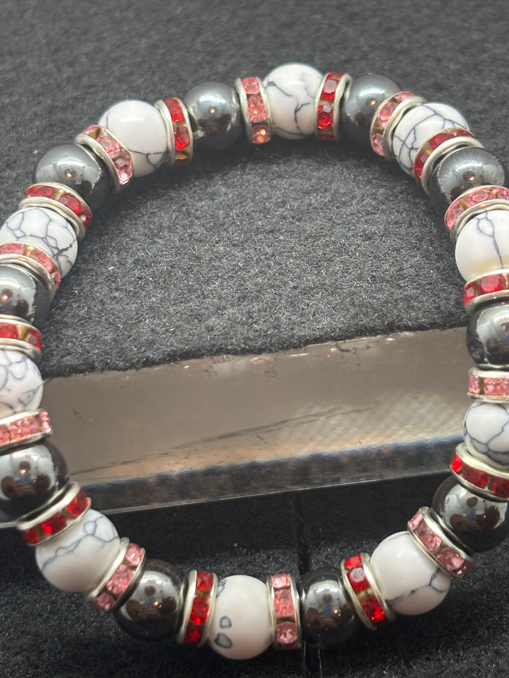 Howl Lite and Hematite Beaded Bracelet with Red Rhinestone spacers