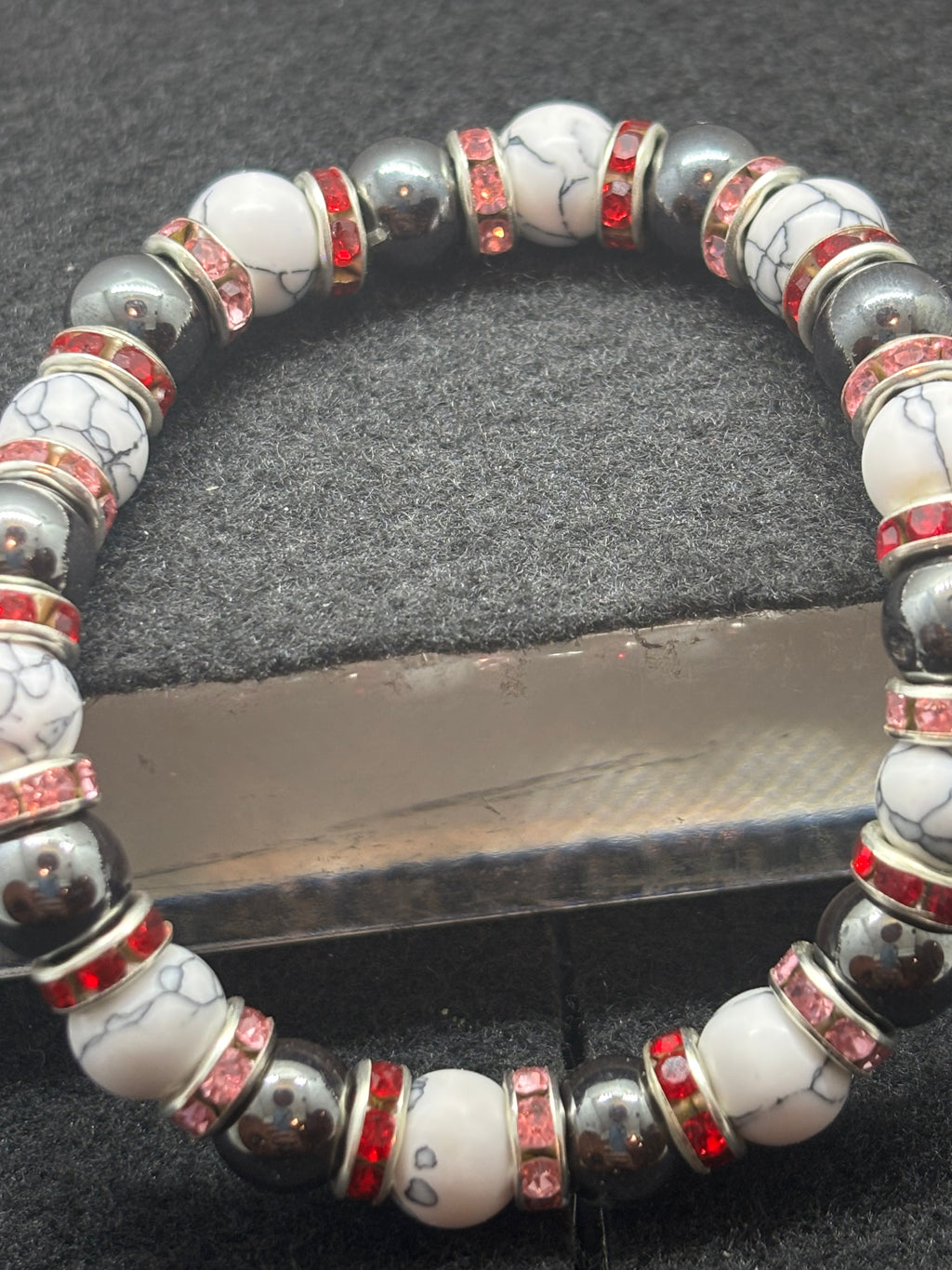 Howl Lite and Hematite Beaded Bracelet with Red Rhinestone spacers